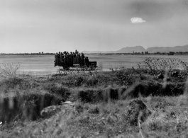 A truck with crews and mechanics zipping around Kunming base, during WWII.