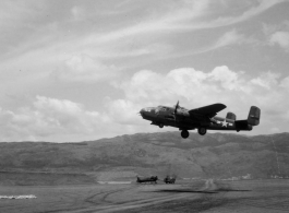 B-25 Mitchell bomber, #438, takes off from an airstrip, at Yangkai (Yangjie) air strip in Yunnan province, China.