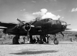 B-25 and crew at Yangkai, late 1944? Looks like 436 (same as large group picture) just coming in new to the squadron.  The big guy kneeling (in silhouette) with the cap brim up is A.B. Christensen.  From the collection of Frank Bates.