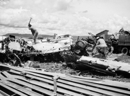 Chinese workers hack up aluminum aircraft in boneyard for American aircraft at an American airbase in Luliang, China--many of these were used as salvage for spare and repair parts for planes that were still flying, and the unusable remains apparently given away or sold locally for the metal.