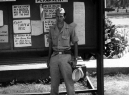 Henry Weiss of Brooklyn, NY; Tec 4, 219th Signal Depot Company, standing before a bulletin board at Tollygunge, India, during WWII.