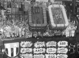 "Cheering U.S. veterans of the China-Burma-India campaigns arrive in New York September 27, 1945, aboard the Army transport General A. W. Greely. The men and women were members of the Flying Tigers, Merrill's Marauders, and other heroic outfits. International News Photos."