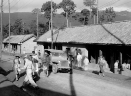 Offices and hostel area at Yangkai air base during WWII. Sign says, "Drive SLOW--Dust".