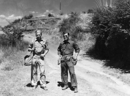 Photographer Eugene Wozniak and a language interpreter take a stroll about in Yunnan, China, during WWII.