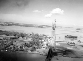 Large and inexplicable explosion near the Ninh-Bình railway bridge in French Indochina (Vietnam), during WWII. Ninh Bình is a small city in the Red River Delta of northern Vietnam, and along a critical rail route used by the Japanese.  Coordinates: 20°15'39.7"N 105°59'06.3"E