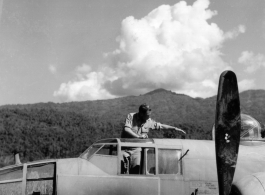 10CU 5G11 G Helicopter Salvage Secret. B-25J "Cornhusker," serial #43-3951, hard on the ground in China. A GI salvages gauges from the cockpit of the wrecked craft.