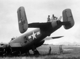 Howard Mealey, Stengle on the B-25 "Rum Runner", tail number #445, Liuzhou, June 1944.  The aircraft had crashed landed after returning from a mission and the men are in the process of salvaging all useable parts. (Info courtesy Tony Strotman)