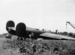 Salvage of a broken B-24 "WE'REWOLVES", crashed on take-off crash on March 20th, at Panagarh. Upon crash, live bombs were spewed out of the bomb bay. Fortunately the arming pins were still in the fuses. Speculation of some was that the accident was caused by loss of lift due to the negative angle of attack caused by a high speed take-off.