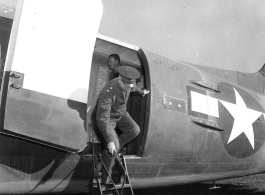 Major Gen. A.C. Wedemeyer and Brig. Gen. Frank Dorn leaving plane at Tengchong airport.  December 18, 1944.  Photo by T/Sgt. S. L. Greenberg. 164th Signal Photographic Company, APO 627.  Passed by William E. Whitten.