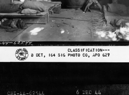 Mafu (马夫) horse-keeper quarters in revetment stable with bomb shelter dug into earth at far end.  December 6, 1944.  Photo by T/5 William E. Shemorry. 164th Signal Photographic Company, APO 627.  Passed by William E. Whitten.