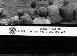 Chinese acrobatic group puts on show for Burma Road Engineers (BRE) members at the air strip, at Tengchong, China.  December 8, 1944.  Photo by T/Sgt. Greenberg. 164th Signal Photographic Company, APO 627.  Passed by William E. Whitten.