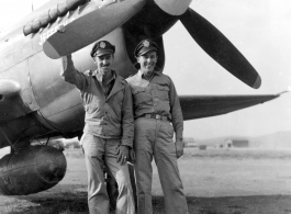 American flyers pose with P-40 fighter plane nicknamed "Jeffery C." in the CBI during WWII.