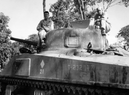 GIs on tank along Burma Road.  797th Engineer Forestry Company in Burma.  During WWII.