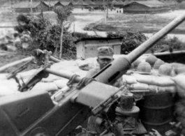 Engineer of the 2005th Ordnance Maintenance Co. working on anti-aircraft gun in India or Burma during WWII.