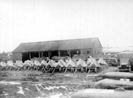 Canvas-shrouded anti-aircraft guns in Burma or India. 2005th Ordnance Maintenance Company, 28th Air Depot Group, WWII.