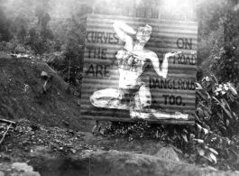 Curvy road sign in Burma, warning of dangers ahead, WWII.