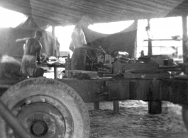 Men of the 2005th Ordnance Maintenance Company,  28th Air Depot Group, working on an anti-aircraft gun in Burma. During WWII.