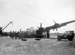 Salvage of a broken B-24 "WE'REWOLVES", crashed on take-off crash on March 20th, at Panagarh. Upon crash, live bombs were spewed out of the bomb bay. Fortunately the arming pins were still in the fuses. Speculation of some was that the accident was caused by loss of lift due to the negative angle of attack caused by a high speed take-off.