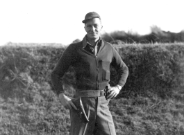 Carlisle Shepard posing with pistol at Zhanyi, Yunnan, China, during WWII, in February, 1945.