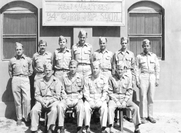 24th Mapping Squadron C.O. and staff pose for a group shot. (December 1944-May 1945.)  Rear: Lt. Key, Capt. Smith, Lt. Walters, Capt. Rebers, Capt. Geiger, Lt. Kunn, Lt. Maddox.  Front: Capt. Hiendell, Major Hubers, Lt. Col. King, Capt. Bagshaw.  Image originally from Charles A. Runyon.