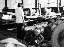 Chinese refugees make do at the train station in Liuzhou during WWII, in the fall of 1944, as the Japanese advanced during the Ichigo campaign.
