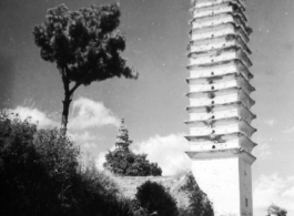 Pagoda in Dali, Yunnan province, China, during WWII. This is one of three pagodas within a single walled compound. The compound a had been appropriated for use by Nationalist troops. Later, after the communist revolution, the compound was also used by troops, but by PLA troops.