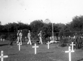 GIs visit an American graveyard.   William Pribyl, 961st Petroleum Products Laboratory.