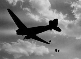 A US C-47 cargo plane drops supplies from the air. ...  10 CU...  2ND T.C. AIR SUPPLY SEC.