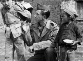 Ted Karczewski (??) with Chinese children somewhere in China.