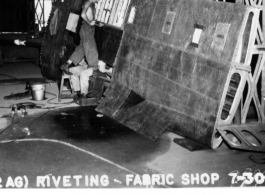 Repairing an aluminum wing, 97th Repair Squadron, fabric shop on July 30, 1944.