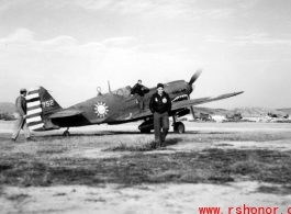 A P-40, tail #752, with nationalist markings, and two American servicemen in the CBI.