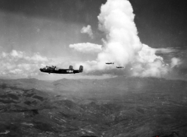 A 491st Bomb Squadron aircraft on a formation mission in China, #439, "Rum Runner." It was destroyed in a crash landing at Liuzhou in June 1944.  Two more aircraft are silhouetted against the cloud in the background. They  appear to also be B-25s, however, we are unable to identify  whether they are also 491st or aircraft from the 11th Bm Sq.  Planes from both squadrons flew many joint missions from February 1944 until the summer of 1945.