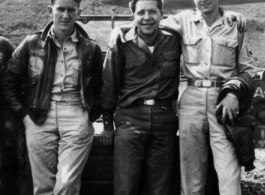 Servicemen out near the flight line loading bombs in SW China during WWII, mostly likely in Yunnan.