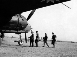 Chinese and American officers prepare for a mission on a B-25J at an unidentified base. Their Squadron (unknown) is part of the 1st Bombardment Group, Chinese-American Composite Wing (CACW).