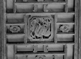 Carved wood panels, usually part of a door or partition.  In Yunnan or Guangxi province. During WWII.