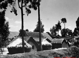 A local village in China during WWII, the houses with thatched roofs.