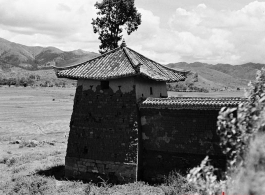 The corner of a walled compound in Yunnan province, China, during WWII.