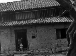 Local people in China--a village home in Yunnan province during WWII.