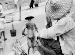 People along the ramp to the floating bridge to Liuzhou city, Guangxi province, during WWII.