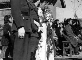 A group wedding in Yunnan province, China, during the hard war years of WWII.  Many of the grooms would have been soldiers and group weddings really came into style at around or just before the war years.