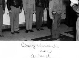 "Casey Vincent crew award." During WWII. Clinton D. "Casey" Vincent is the tall one in back, second from the right.  Far left is probably  Lt. Col. Grattan "Grant" Mahony (commander of the 76th Fighter Squadron).