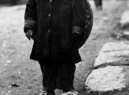 Young refugee fleeing during the evacuation before the Japanese Ichigo advance in 1944, in Guangxi province.