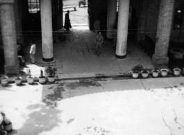 An American soldier walks in a quiet courtyard somewhere in Guizhou province, probably Anshun city or Guiyang (Kweiyang) city.  Since Guiyang was the capital of Guizhou, Americans often used that name for the whole province.