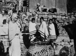 Naga tribe women at a native bazaar in Burma. In the CBI.