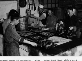 Kitchen at Hsinching, China during WWII. T/Sgt. Paul West with cook.  Photo from Paul A. West.