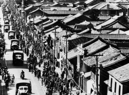 Chinese crowds eagerly welcome the first US land convoy of supplies arrives in Yunnan province after completion of the Burma/Ledo/Stilwell road.  In the CBI.  By U. S. Army Signal Corps.