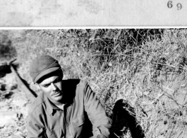 Sgt. James F. Collier demonstrating clamp he just made for purpose of holding pipe together for welding. December 29, 1944. 1381st Engineer Petroleum Dist. Co. Photo by T/5 Thomas Richie.