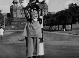 A Calcutta traffic policeman directs traffic from his raised stand from under a canopy.   Photo from Samuel J. Louff.