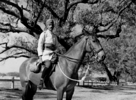 A Calcutta mountie takes a moment to pose for a souvenir snapshot by J. F. Thomas. During WWII.