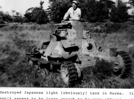 A GI climbs inside a destroyed Japanese light tank in Burma during WWII.  Photo from Walter Ericsson. 